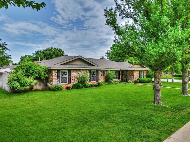 5200 Kingswood Cir, Amarillo, TX 79109 - ranch-style house featuring a front lawn, brick siding, roof with shingles, and a chimney
