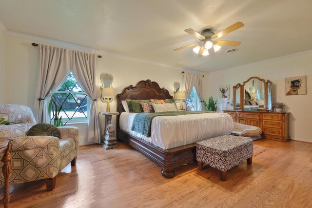 5200 Kingswood Cir, Amarillo, TX 79109 - bedroom with multiple windows, light wood-style floors, ornamental molding, and ceiling fan