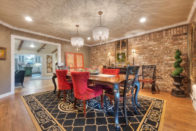 5200 Kingswood Cir, Amarillo, TX 79109 - dining area with a chandelier, wood finished floors, arched walkways, and crown molding