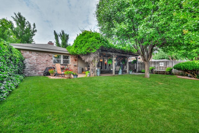 5200 Kingswood Cir, Amarillo, TX 79109 - rear view of property with brick siding, a patio area, and a chimney