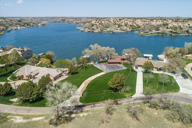 birds eye view of property with a water view and a residential view
