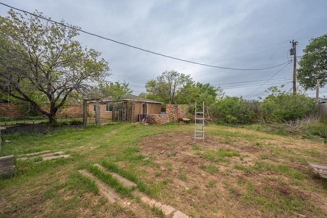 view of yard featuring fence