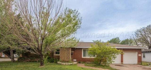 3414 S Austin St, Amarillo, TX 79109 - ranch-style home featuring concrete driveway, a front lawn, an attached garage, and brick siding