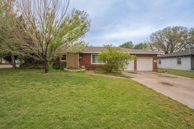 single story home featuring an attached garage, a front yard, driveway, and brick siding