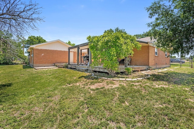 745 Fairlane St, Amarillo, TX 79108 - rear view of house featuring brick siding and a wooden deck