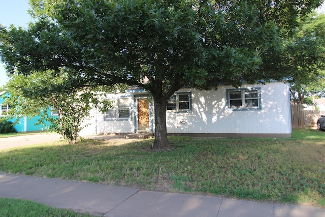 1035 Bagarry St, Amarillo, TX 79104 - view of property hidden behind natural elements featuring a front yard