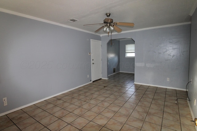 1035 Bagarry St, Amarillo, TX 79104 - unfurnished room featuring a ceiling fan, ornamental molding, arched walkways, and light tile patterned flooring