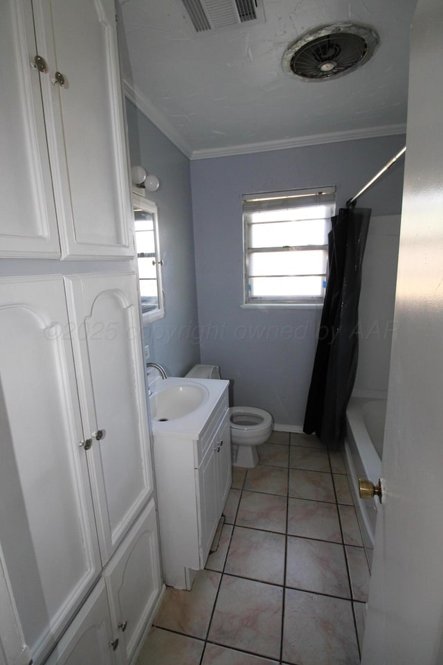 1035 Bagarry St, Amarillo, TX 79104 - bathroom featuring ornamental molding, vanity, tile patterned flooring, and shower / bath combo