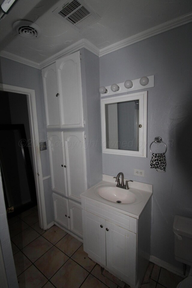 1035 Bagarry St, Amarillo, TX 79104 - bathroom with vanity, tile patterned floors, and ornamental molding