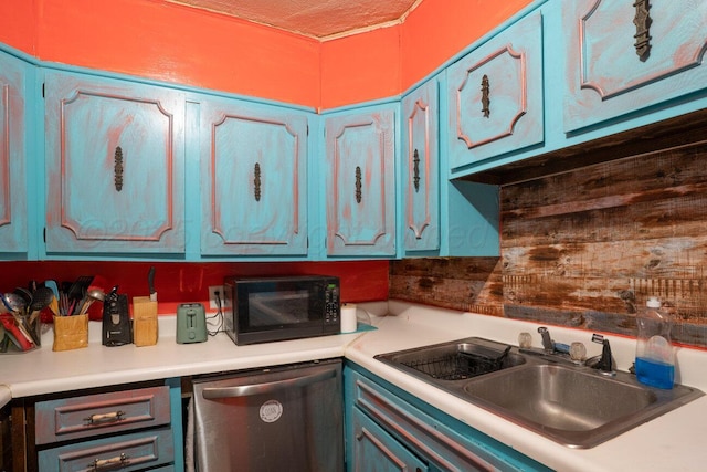 713 N Dwight St, Pampa, TX 79065 - kitchen with stainless steel dishwasher, black microwave, a sink, and light countertops