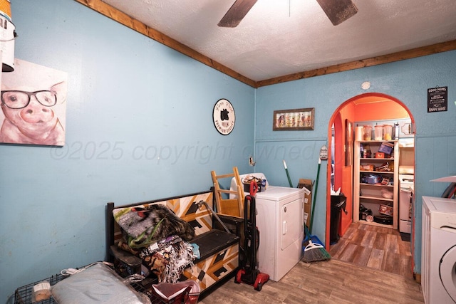 713 N Dwight St, Pampa, TX 79065 - laundry area with laundry area, a ceiling fan, wood finished floors, washer / clothes dryer, and arched walkways