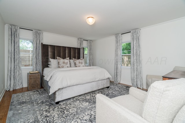 3220 S Travis St, Amarillo, TX 79109 - bedroom with wood finished floors, multiple windows, and baseboards