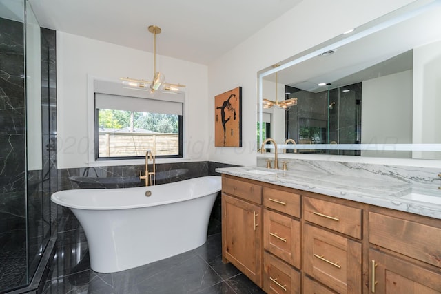 3220 S Travis St, Amarillo, TX 79109 - full bathroom with a chandelier, tile walls, a shower stall, double vanity, and a freestanding tub