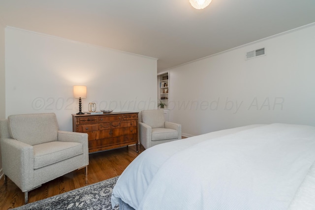 3220 S Travis St, Amarillo, TX 79109 - bedroom with wood finished floors and crown molding