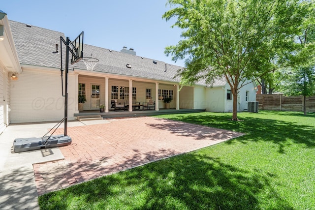 3220 S Travis St, Amarillo, TX 79109 - rear view of property with a patio, central AC, a shingled roof, and a chimney