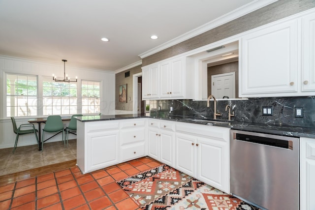 3220 S Travis St, Amarillo, TX 79109 - kitchen featuring stainless steel dishwasher, a sink, a chandelier, a peninsula, and crown molding