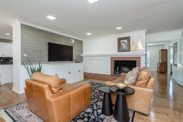 3220 S Travis St, Amarillo, TX 79109 - living room featuring a brick fireplace, wood finished floors, crown molding, and recessed lighting