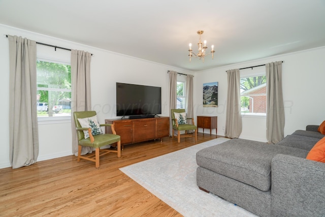 3220 S Travis St, Amarillo, TX 79109 - living area with a chandelier, light wood-style floors, ornamental molding, and baseboards