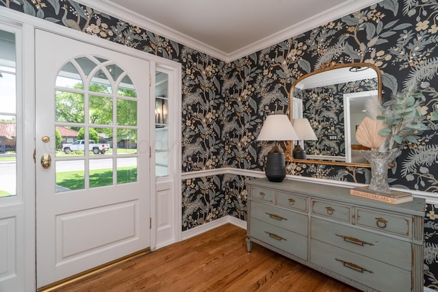 3220 S Travis St, Amarillo, TX 79109 - entryway featuring wallpapered walls, wood finished floors, plenty of natural light, ornamental molding, and baseboards