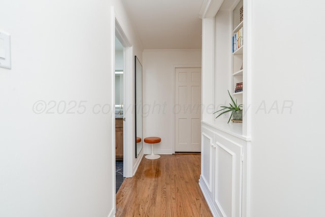 3220 S Travis St, Amarillo, TX 79109 - hallway with light wood-style flooring and crown molding