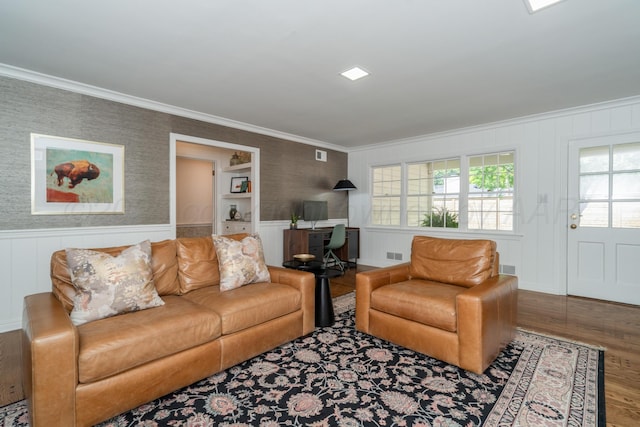 3220 S Travis St, Amarillo, TX 79109 - living room with crown molding, wood finished floors, wainscoting, and a decorative wall