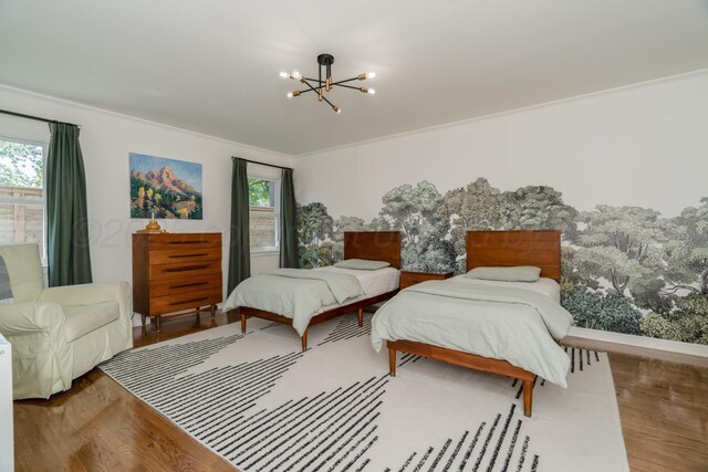 3220 S Travis St, Amarillo, TX 79109 - bedroom featuring a chandelier, wood finished floors, and multiple windows