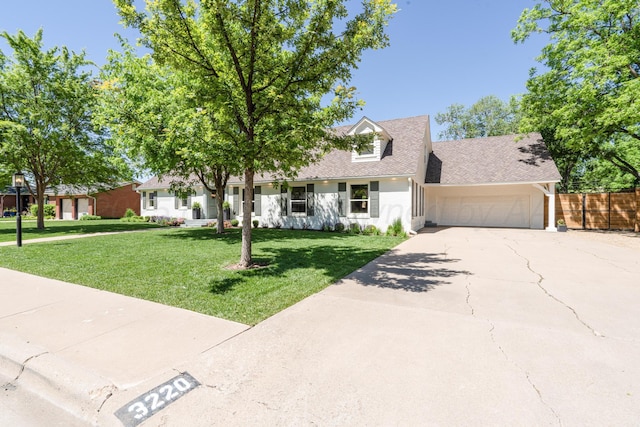 3220 S Travis St, Amarillo, TX 79109 - cape cod house with a garage, concrete driveway, and roof with shingles