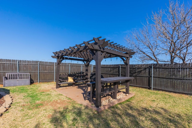 view of yard with a fenced backyard and a pergola