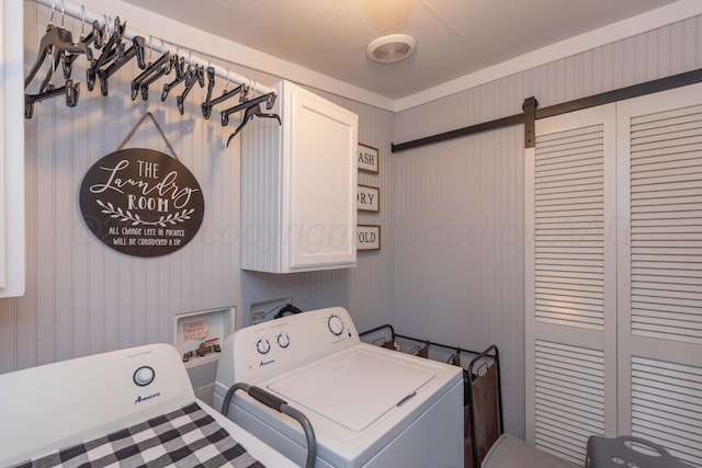 washroom with cabinet space, visible vents, and separate washer and dryer