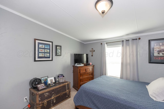 carpeted bedroom featuring crown molding