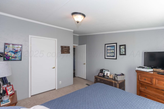 carpeted bedroom with crown molding