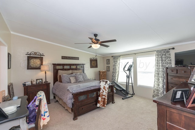 bedroom with light carpet, crown molding, a ceiling fan, and vaulted ceiling