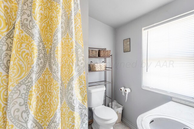 bathroom featuring toilet