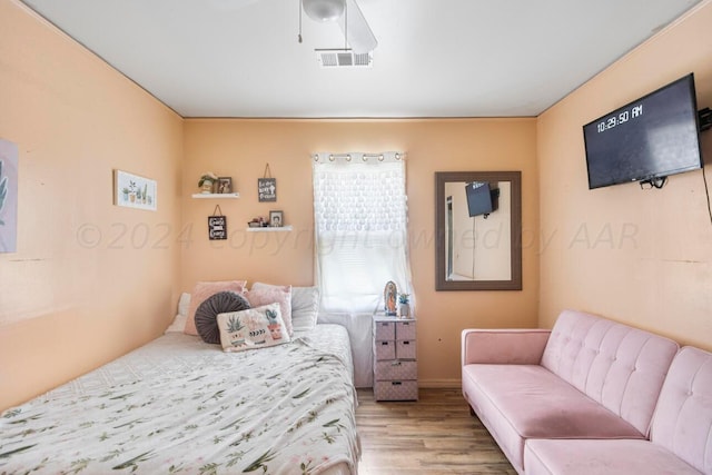 bedroom with light wood-type flooring