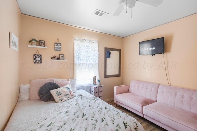 bedroom with hardwood / wood-style flooring and ceiling fan