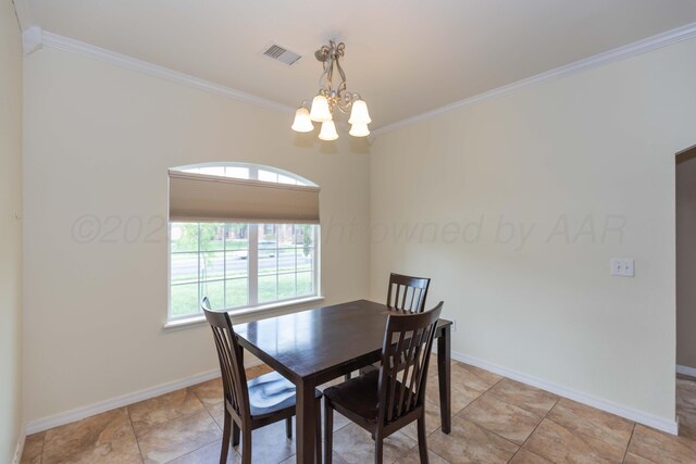 3508 Bismarck Ave, Amarillo, TX 79118 - dining room with healthy amount of natural light, crown molding, a chandelier, and baseboards