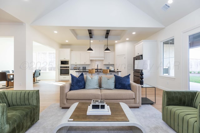 kitchen featuring white cabinets, dark countertops, open floor plan, and decorative backsplash
