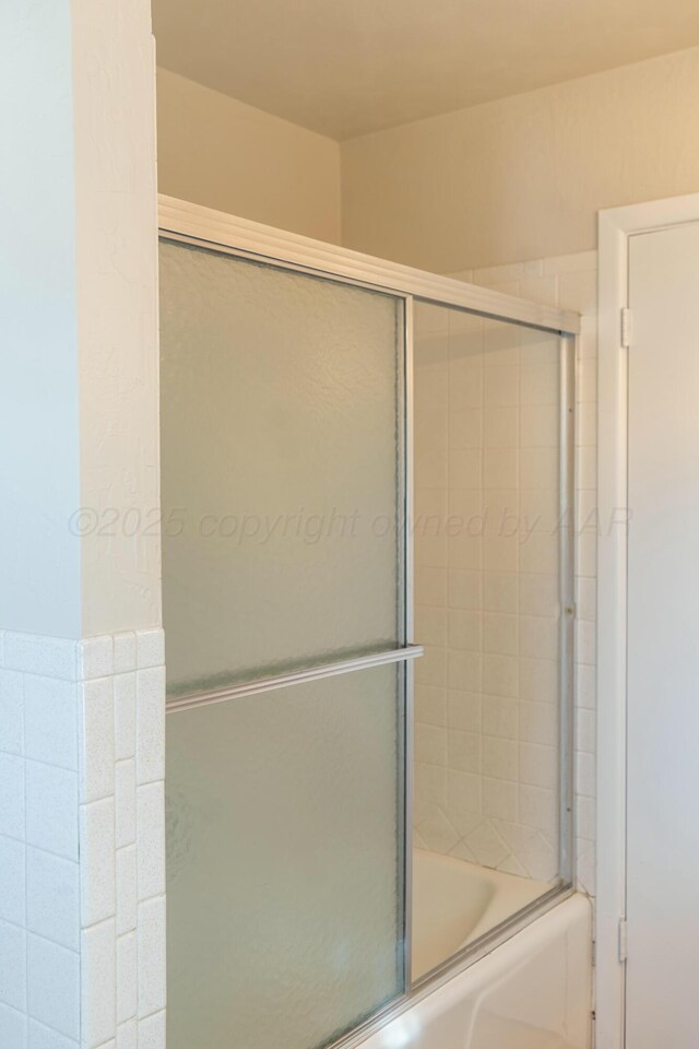 bathroom featuring enclosed tub / shower combo