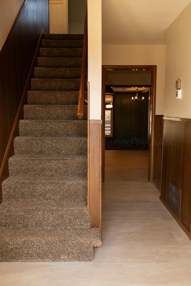 stairs with wood walls