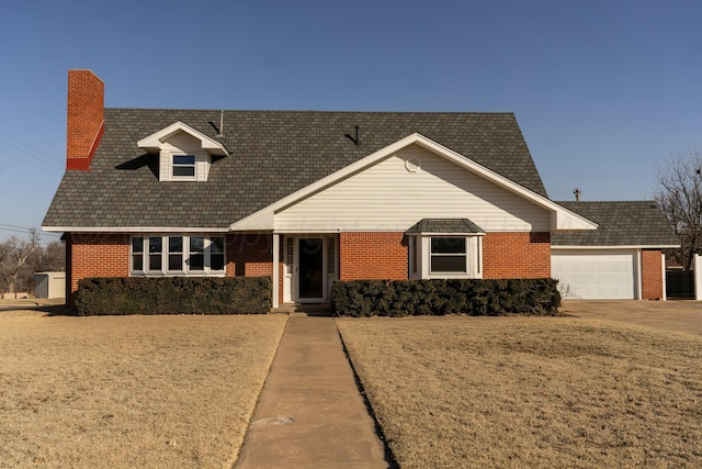 view of front facade with a garage and a front yard