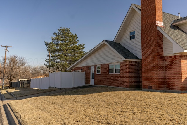 view of property exterior featuring a yard