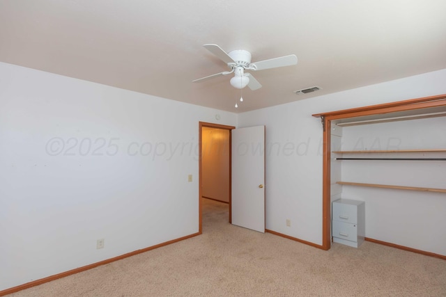 unfurnished bedroom featuring carpet floors, a ceiling fan, visible vents, baseboards, and a closet