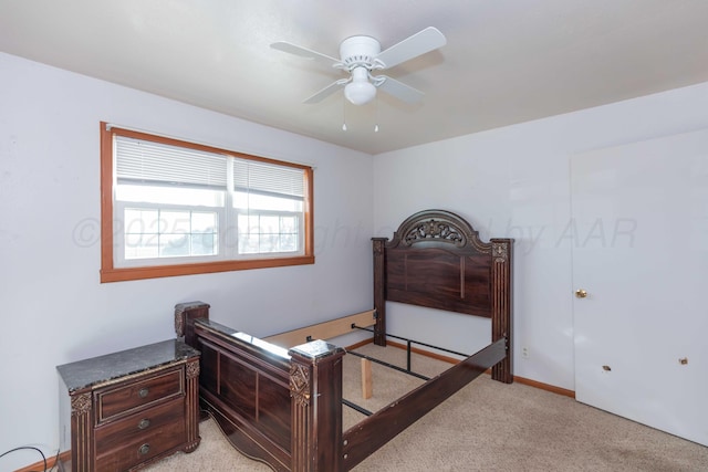 bedroom featuring light colored carpet and ceiling fan