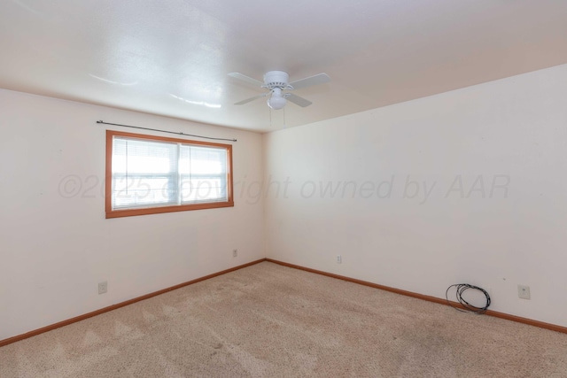 unfurnished room with light carpet, ceiling fan, and baseboards