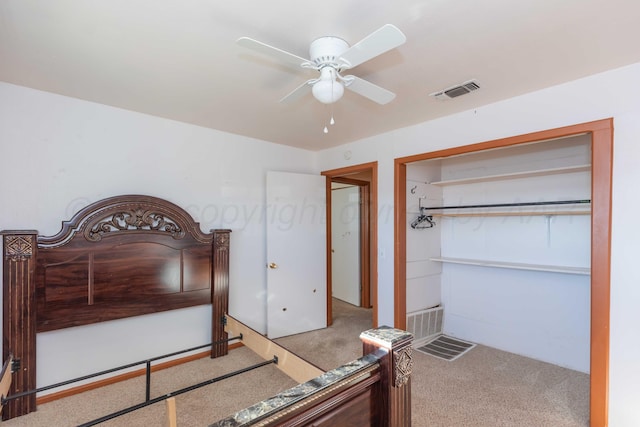 bedroom with ceiling fan, carpet floors, and visible vents