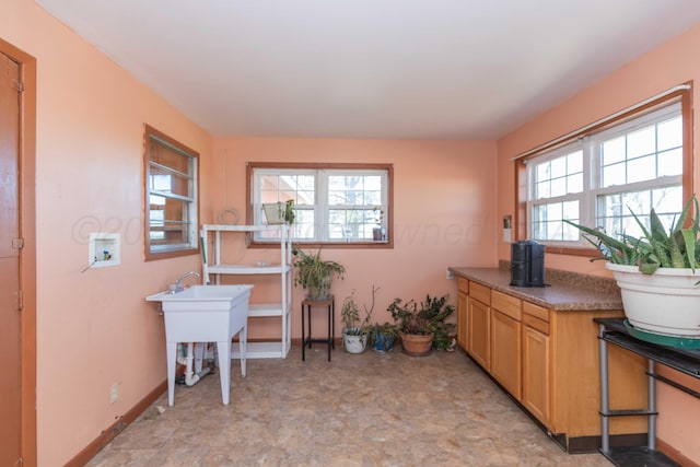 home office with a healthy amount of sunlight and baseboards