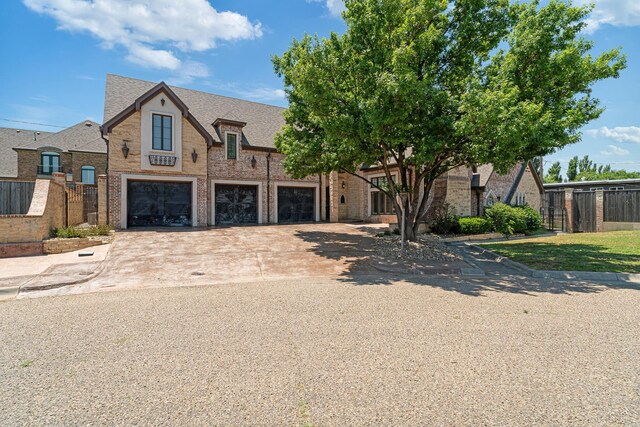 4 Kingsridge Pl, Amarillo, TX 79106 - view of front of house with brick siding, a garage, and concrete driveway