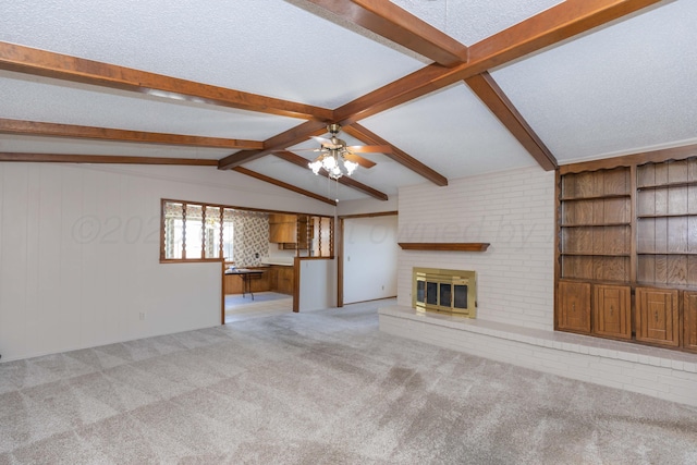 6111 Princeton St, Amarillo, TX 79109 - unfurnished living room featuring ceiling fan, a fireplace, carpet floors, and a textured ceiling