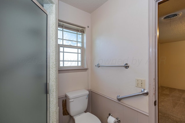 6111 Princeton St, Amarillo, TX 79109 - bathroom featuring a textured ceiling and a shower stall