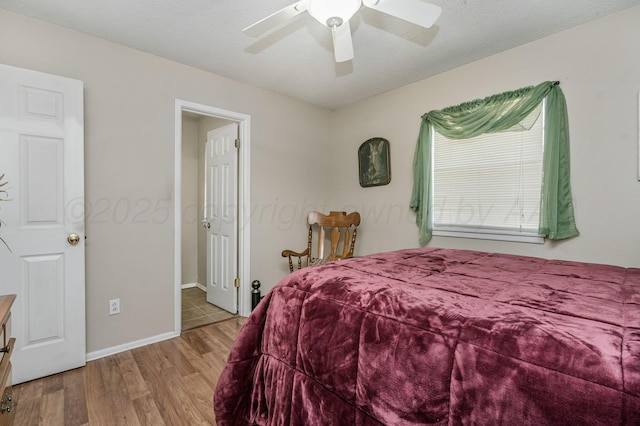 5222 S Travis St, Amarillo, TX 79110 - bedroom with wood finished floors and a ceiling fan